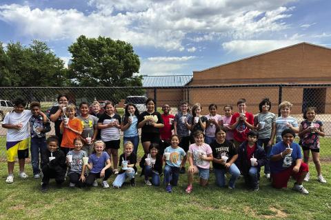 Congratulations to these third graders for showing mastery of multiplication facts! They were treated to extra recess and a shaved ice from Space Shavers. Courtesy photo