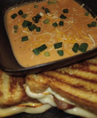 January is National Soup Month. Pictured is a bowl of tomato soup using the recipe in this article, paired with a bacon grilled cheese sandwich. Kathleen Guill | Press-Leader